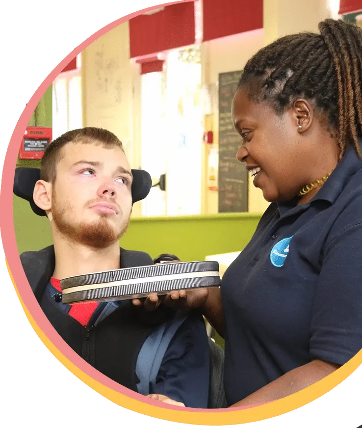 Young Adult taking part in Music Therapy at The Js Charity